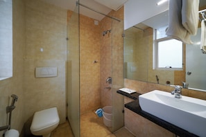 Studio | Bathroom | Shower, free toiletries, towels, soap - VH Hotels Domlur (Bengaluru)