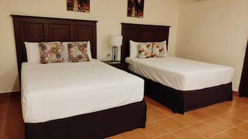 Family Quadruple Room | Pillowtop beds, individually decorated