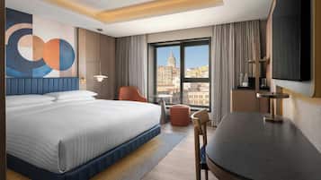 Luxe beddengoed, een minibar, een kluis op de kamer, een bureau