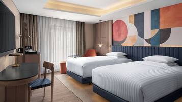 Rom, 2 enkeltsenger | Sengetøy av topp kvalitet, minibar, safe på rommet og skrivebord