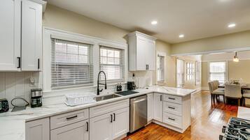 Coffee/tea maker, cookware/dishes/utensils, dining tables