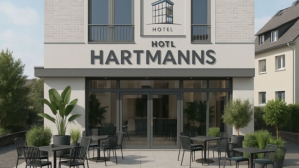 A modern hotel building with a sign reading "HOTEL HARTMANNs". - Das Hartmanns (Pegnitz)
