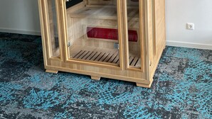 A wooden cabinet with glass doors, shelves, and a ventilation system. - Das Hartmanns (Pegnitz)