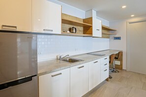 Apartment, Balcony | Private kitchenette | Full-sized fridge, microwave, stovetop, electric kettle