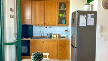 Fridge, stovetop, coffee/tea maker, dining tables