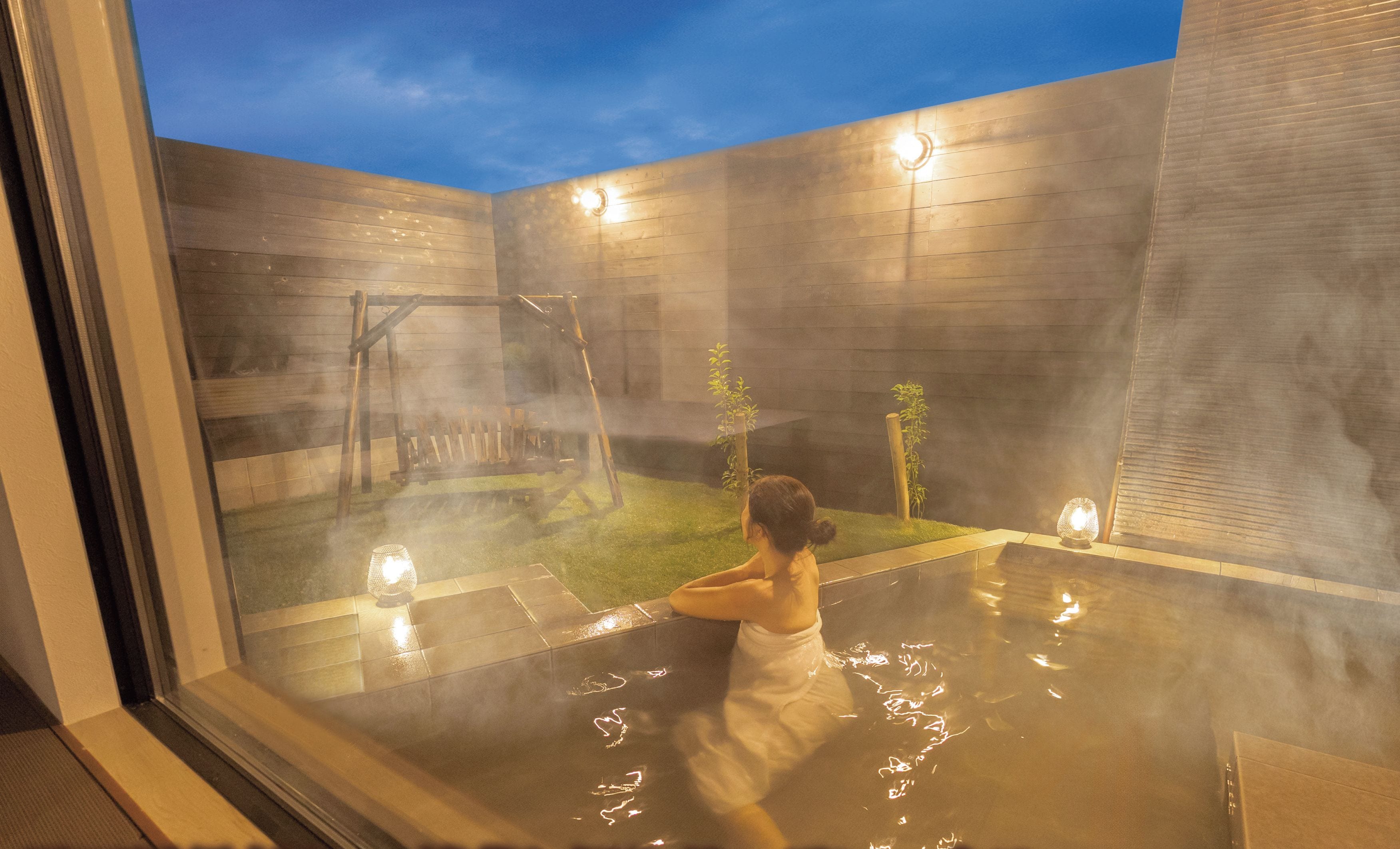 A private villa with a garden and an open-air onsen.