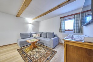 Family House, 2 Bedrooms, Garden View | Living area | 50-inch flat-screen TV with cable channels