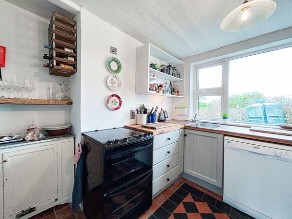 Microwave, dishwasher, high chair, cookware/dishes/utensils