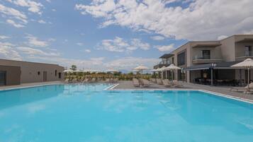 Indoor pool, seasonal outdoor pool, pool umbrellas, pool loungers