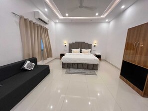 Superior Quadruple Room, Balcony | Desk, laptop workspace, soundproofing, iron/ironing board - Hotel Dream Inn Khajuraho (Rajnagar)