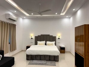 Superior Quadruple Room, Balcony | Desk, laptop workspace, soundproofing, iron/ironing board - Hotel Dream Inn Khajuraho (Rajnagar)