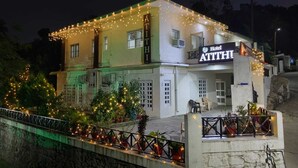 A two-story building with a sign reading "Hotel ATITIHI". - Hotel Atithi Mount Abu (Mount Abu)