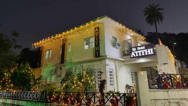 A hotel named "Hotel Athi" with string lights decorating the exterior. - Hotel Atithi Mount Abu (Mount Abu)