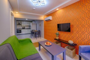Family Condo, 2 Bedrooms, Private Bathroom, City View | Living area | 32-inch Smart TV with satellite channels
