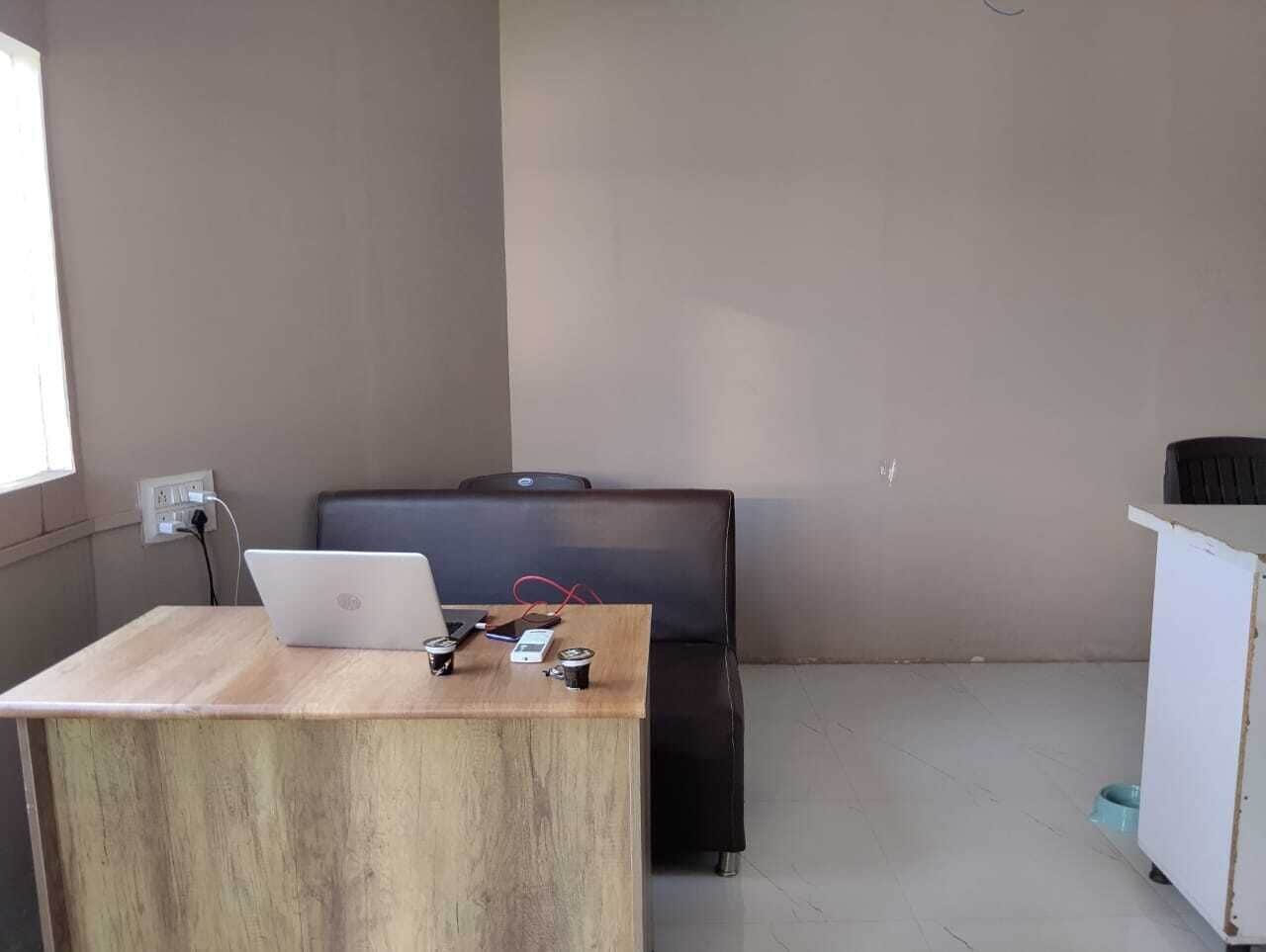 Habitación Deluxe, vista a la ciudad | Área de sala de estar