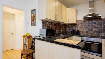 Fridge, microwave, toaster, cookware/dishes/utensils