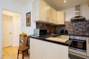 Fridge, microwave, toaster, cookware/dishes/utensils