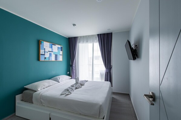 Apartment, Balcony | In-room safe, blackout curtains, iron/ironing board, free WiFi