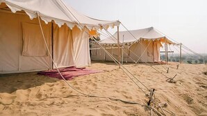 A row of tents in a desert setting. - Bhati Desert Camp Raisar Bikaner (Bikaner)