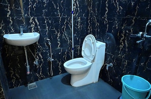 Shower, rainfall showerhead, slippers, towels