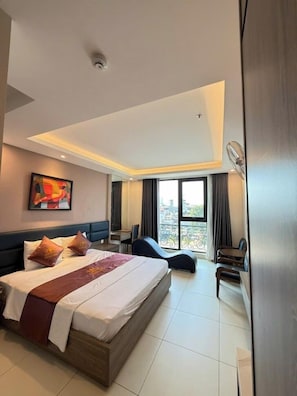 Deluxe Room, Balcony, City View | Desk, free WiFi, bed sheets