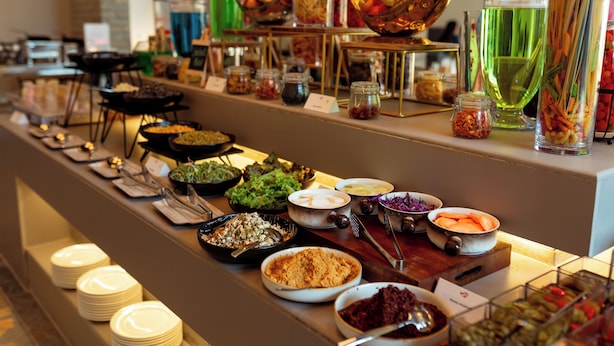 A buffet with various food items and condiments. - Soaltee Westend Lakeside Pokhara (Pokhara)