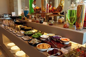 A buffet with various food items and condiments. - Soaltee Westend Lakeside Pokhara (Pokhara)