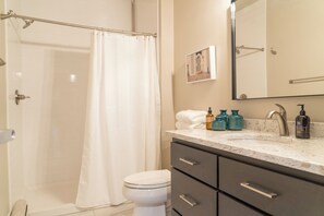 Shower, towels, soap, toilet paper