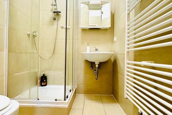 Shower, hair dryer, towels, soap