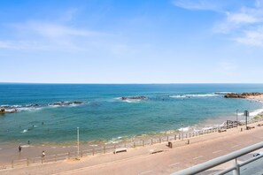 A coastal road with a beach and rocky outcrops. - Cozumel 308 (eMdloti)