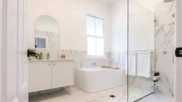 Shower, hair dryer, towels, shampoo
