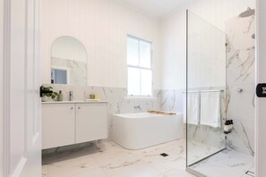 Shower, hair dryer, towels, shampoo