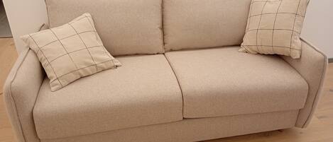 Deluxe Apartment, City View | Living area | 40-inch TV with digital channels