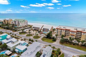 A coastal hotel with multiple buildings, a pool, and a beach view. - Crystal Villas B9 New Listing Specials! Gulf Front, Pool, Free Beach Service (Destin)