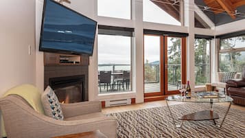 Penthouse Apartment, Harbor View | Living area | 60-inch Smart TV with cable channels, pay films, streaming services