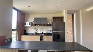 Fridge, microwave, stovetop, coffee/tea maker