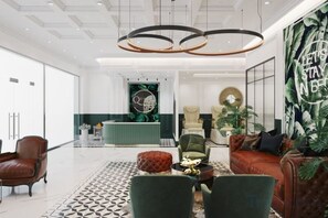A modern hotel lobby with a reception desk, seating area, and a large wall mural. - Nanahousing-Nice Apartment near Korea Town & Chinese Area (Hanoi)