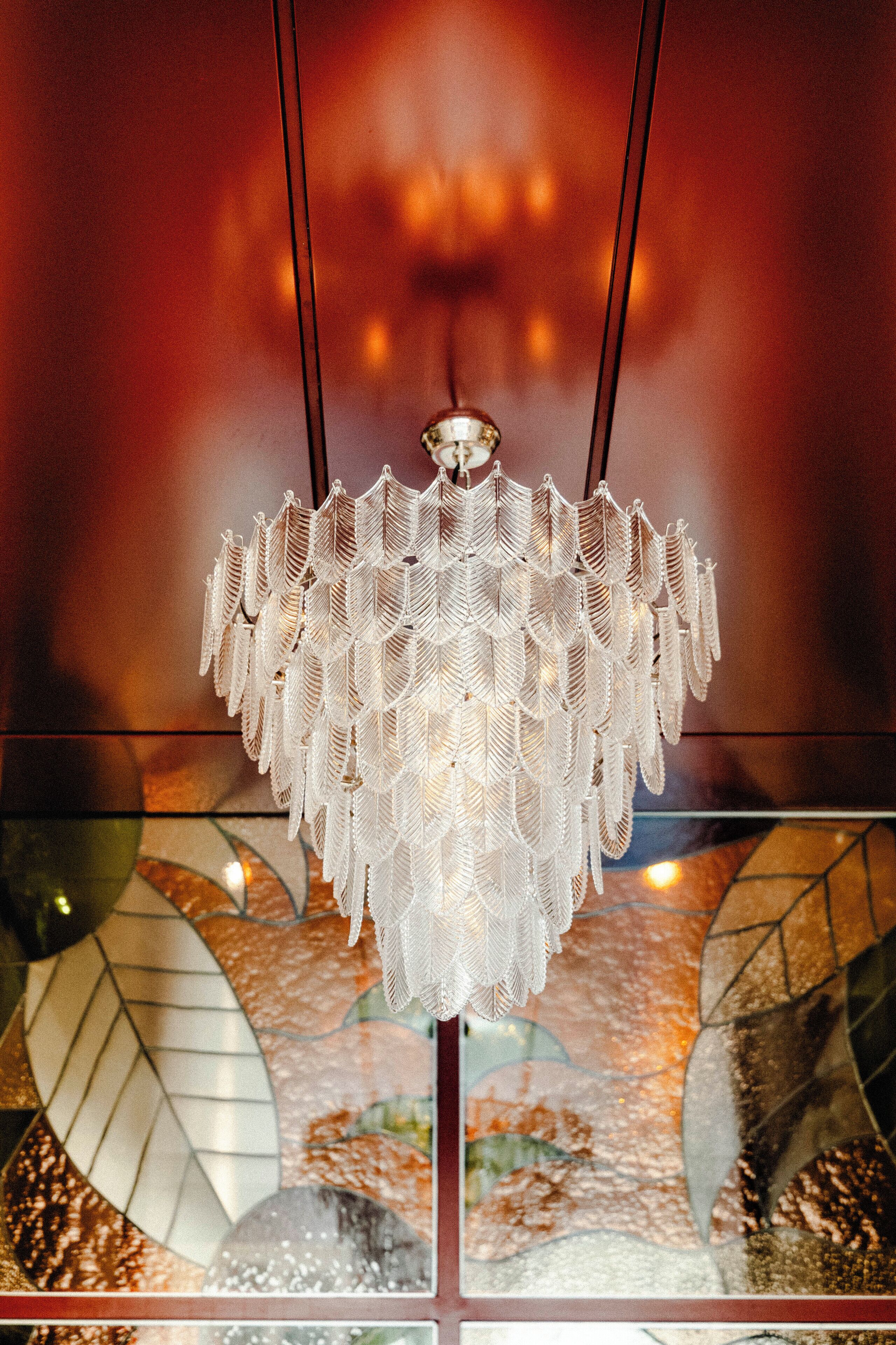 A chandelier with a complex, geometric design hanging from the ceiling.