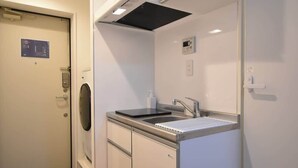 Fridge, microwave, electric kettle, cookware/dishes/utensils