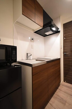 Fridge, microwave, cookware/dishes/utensils