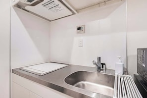 Fridge, microwave, electric kettle, cookware/dishes/utensils
