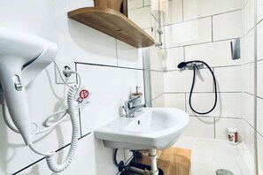 Shower, hair dryer, towels, soap