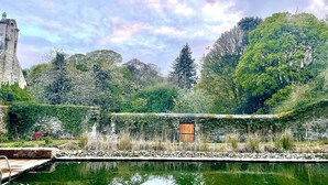 A serene garden with a pond, stone structures, and lush greenery. - Historic Barmeath Castle Guest Wing — Luxury Stay Amid Gardens & Woodland (Dunleer)