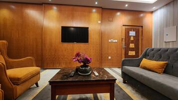 Superior Suite | Living area | 3-cm LCD TV with cable channels