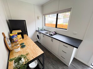 Fridge, microwave, toaster, cookware/dishes/utensils