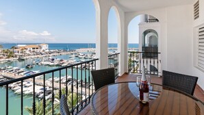 A balcony with a view of a marina and the sea. - Marina Real Port View 2457 (Manilva)