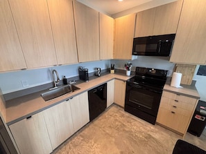 Microwave, stovetop, dishwasher, coffee/tea maker