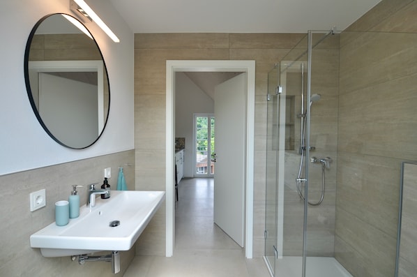 Shower, hair dryer, towels, soap