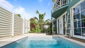 A swimming pool with a white fence, a balcony with white railings, and a view of palm trees. - Villa Mandarine - Two Bedroom Villa, Sleeps 4 (Le Diamant)