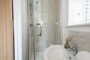 Shower, hair dryer, towels
